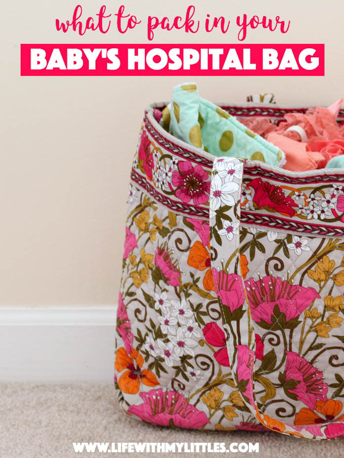 Woman packing diaper bag in maternity hospital. Stock Photo by