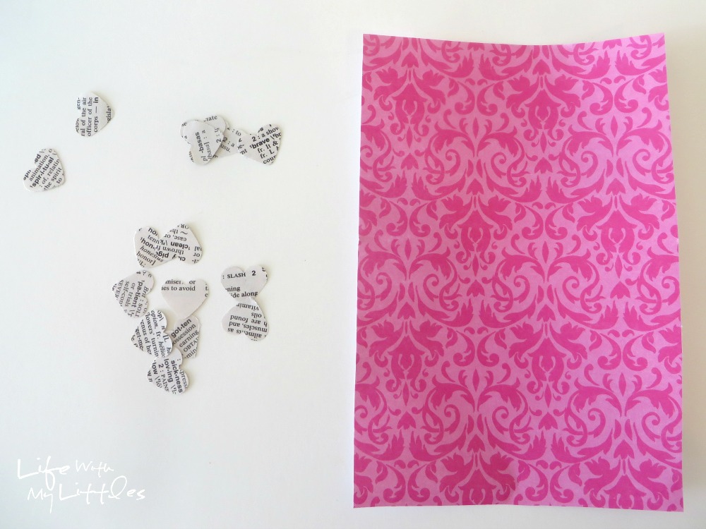 Easy Heart-Punched Dictionary Art: A beautiful, easy, and cute way to decorate a baby girl's nursery.