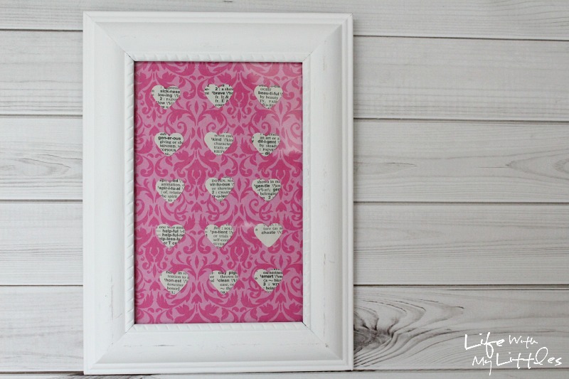 Easy Heart-Punched Dictionary Art: A beautiful, easy, and cute way to decorate a baby girl's nursery.