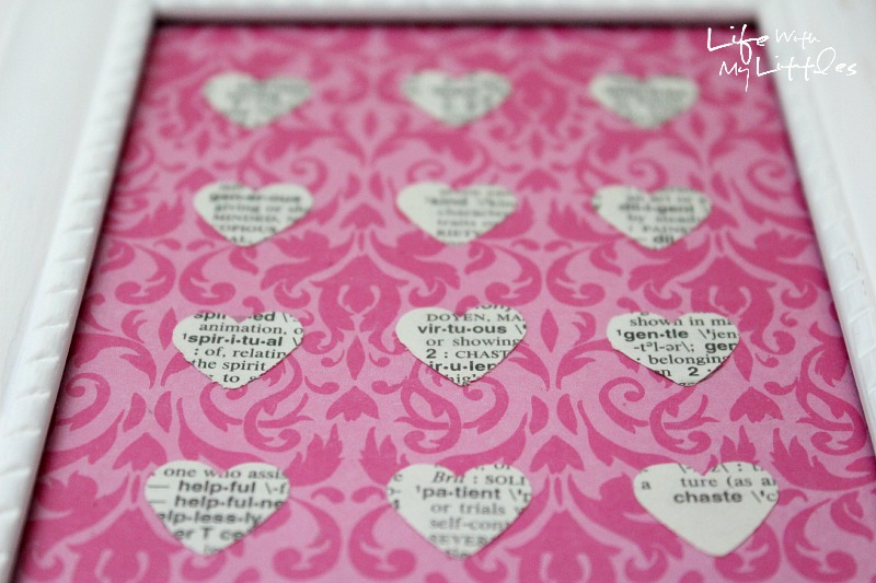 Easy Heart-Punched Dictionary Art: A beautiful, easy, and cute way to decorate a baby girl's nursery.