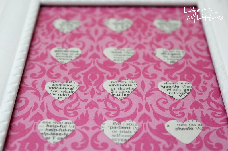 Easy Heart-Punched Dictionary Art: A beautiful, easy, and cute way to decorate a baby girl's nursery.