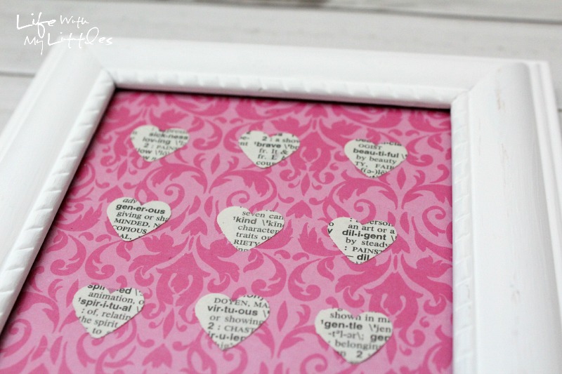 Easy Heart-Punched Dictionary Art: A beautiful, easy, and cute way to decorate a baby girl's nursery.