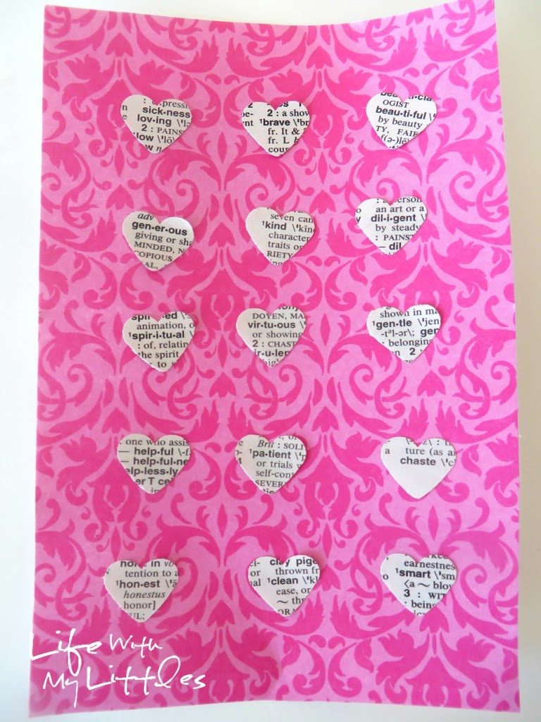 Easy Heart-Punched Dictionary Art: A beautiful, easy, and cute way to decorate a baby girl's nursery.