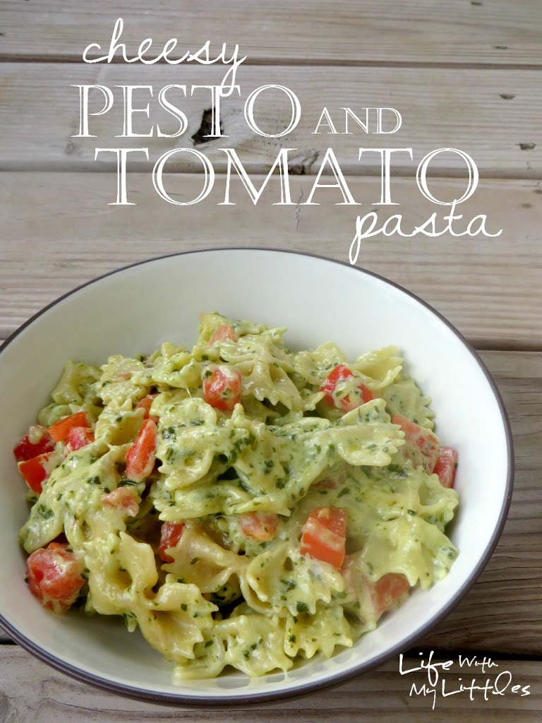 Cheesy Pesto and Tomato Pasta: A creamy, cheesy pasta made with homemade basil pesto and tossed with garden-fresh tomatoes! Perfect for a quick weeknight dinner!