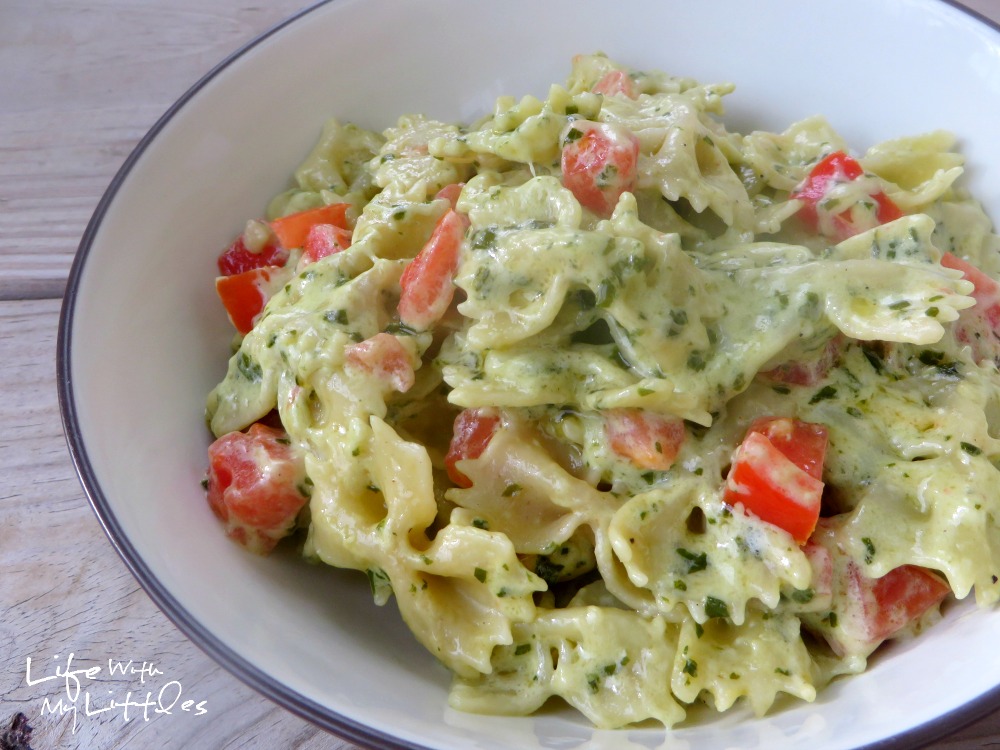 Cheesy Pesto and Tomato Pasta: A creamy, cheesy pasta made with homemade basil pesto and tossed with garden-fresh tomatoes! Perfect for a quick weeknight dinner!