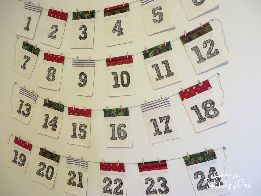 DIY Advent Calendar Garland: Simple fabric pockets make up this cute and easy Christmas advent calendar! DIY Advent Calendar Garland: Simple fabric pockets make up this cute and easy Christmas advent calendar!