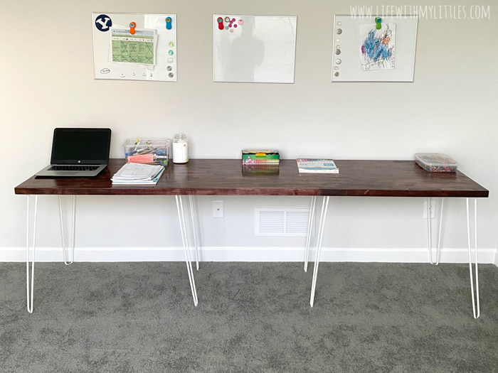 A simple, minimalist DIY triple desk tutorial that even the most beginning of DIYers can tackle! The butcher block countertop gives it a beautiful farmhouse feel and it's perfect for any homework or homeschool room!