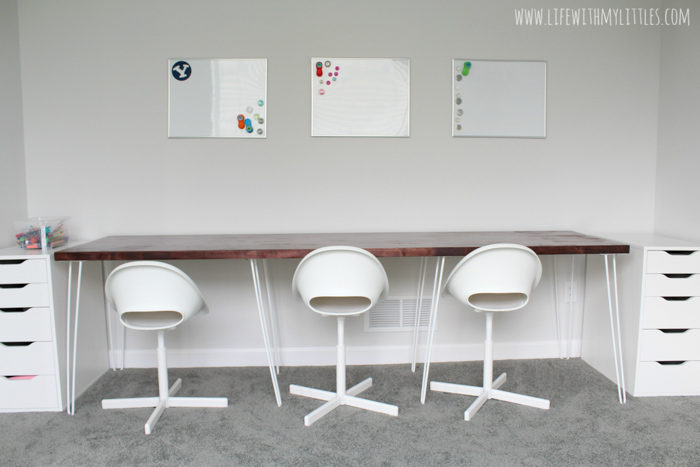 A simple, minimalist DIY triple desk tutorial that even the most beginning of DIYers can tackle! The butcher block countertop gives it a beautiful farmhouse feel and it's perfect for any homework or homeschool room!