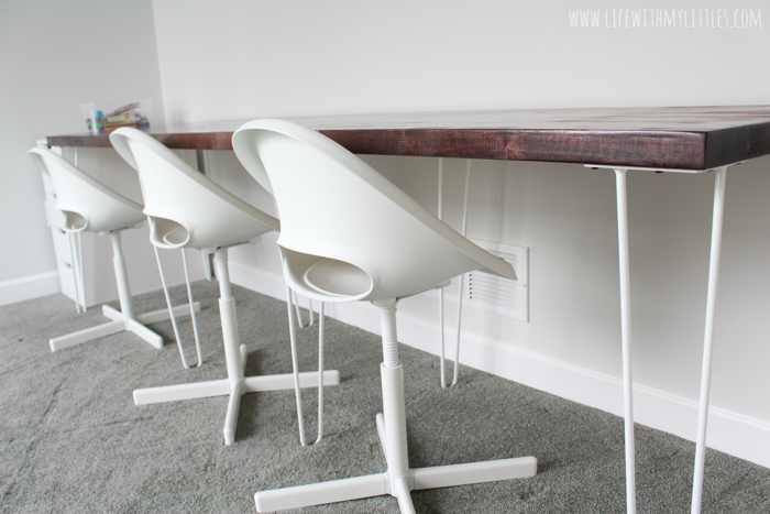 A simple, minimalist DIY triple desk tutorial that even the most beginning of DIYers can tackle! The butcher block countertop gives it a beautiful farmhouse feel and it's perfect for any homework or homeschool room!