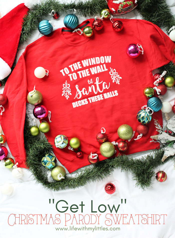 "To the Window, to the Wall, 'Til Santa Decks these Halls" Christmas parody sweatshirt that you can DIY! All you need is a Cricut, vinyl, screen printing supplies, and a sweatshirt to make this hilarious holiday sweater.